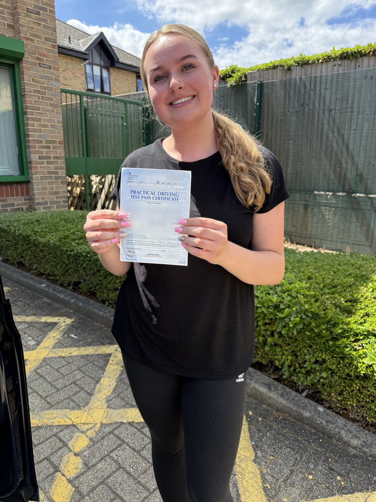A2B student holding their driving test pass certificate